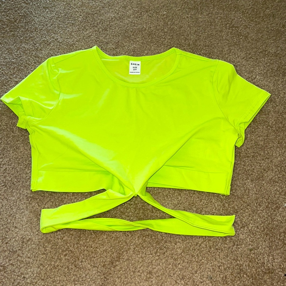 I am selling this neon yellow crop top that wraps around.